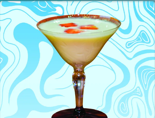 A Drink to Remember, Not to Forget: a creamy white martini topped with strawberry pieces