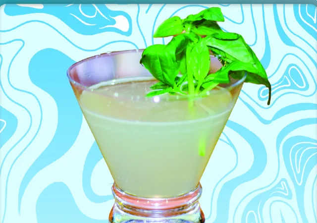Clarity in Paradise: a pale sparkling cocktail garnished with fresh basil