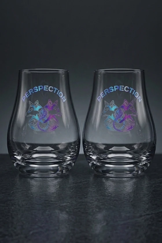 Two Perspection tasting glasses printed with the FoxSwan mark